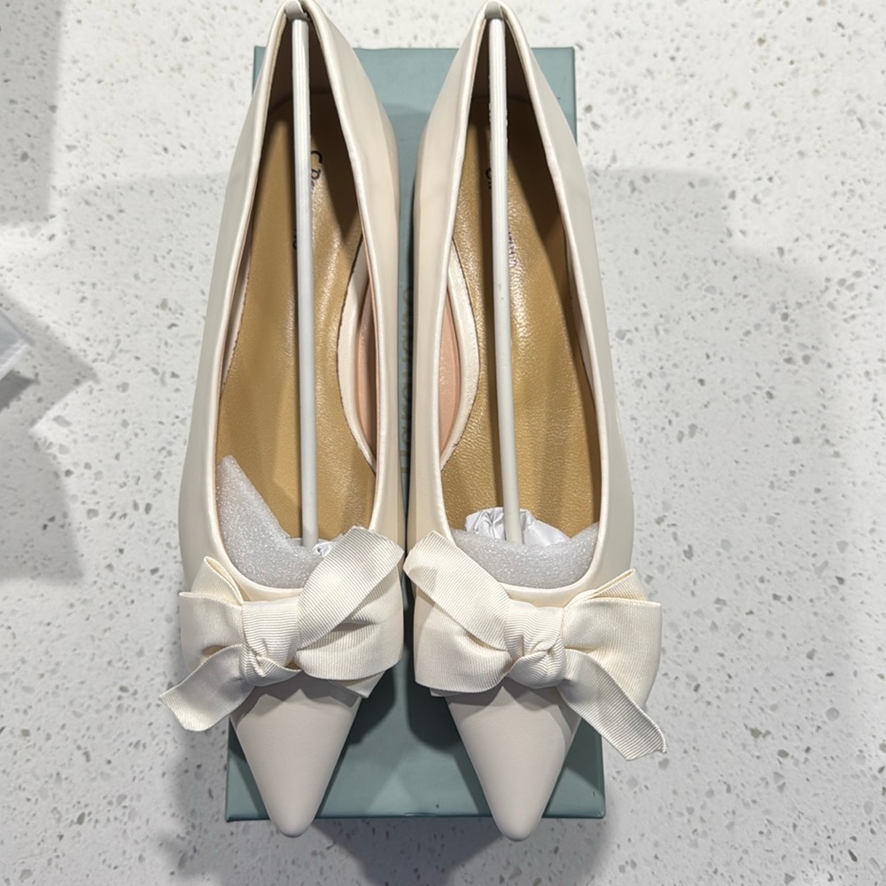 Cream flats with bow